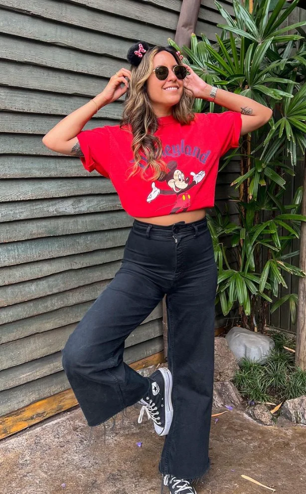 Red Graphic Cropped T-Shirt + Black Wide-Leg Jeans + Black High-Top Sneakers + Black Minnie Ears Headband