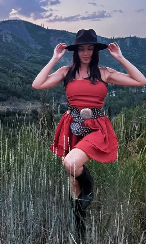 Red Sleeveless Dress + Black Floral Statement Belt + Black Wide-Brim Hat + Black Knee-High Boots
