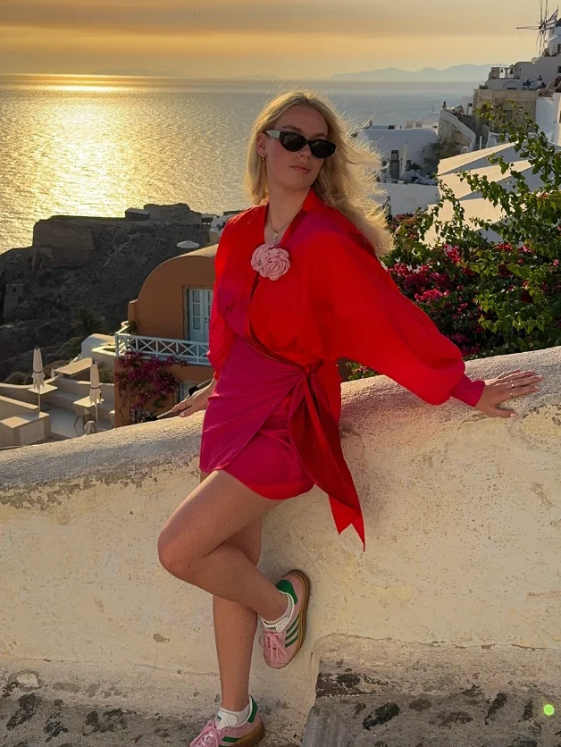Red Wrap Blouse + Hot Pink Mini Skirt + Sneakers + Floral Brooch