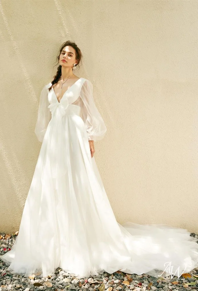 Romantic V-Neck Gown with Sheer Puff Sleeves and Flowing Skirt