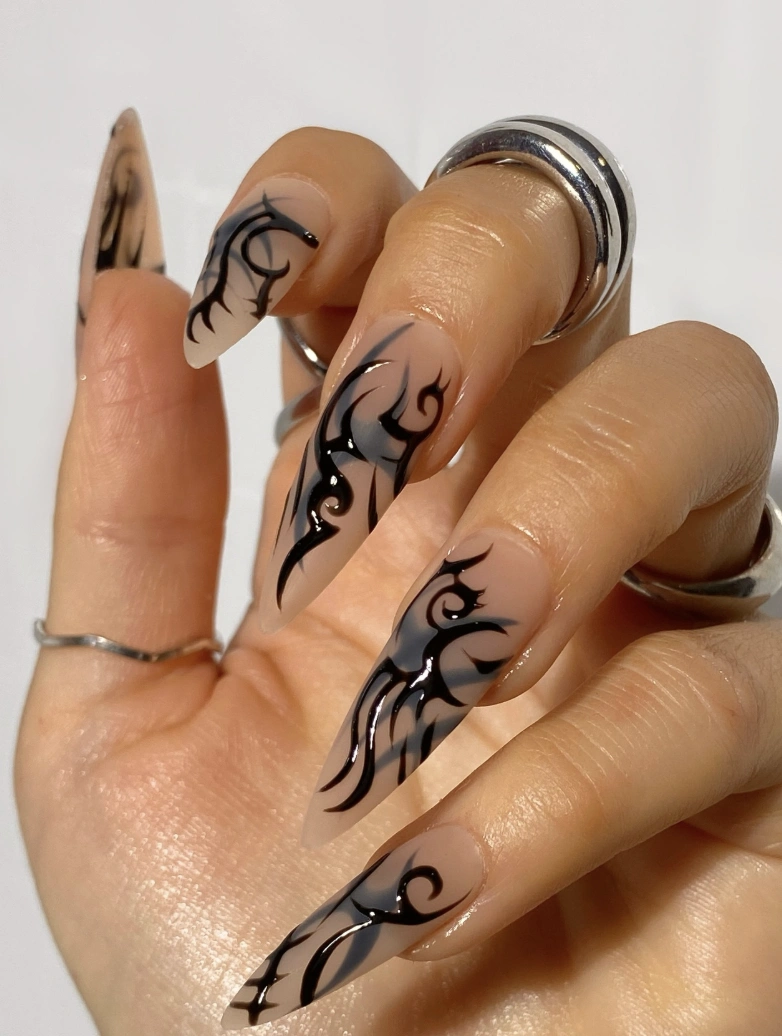 Sharp Stiletto Acrylics with Black Tribal Design