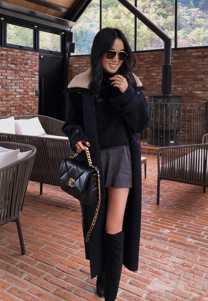 Shearling Collar Coat + Turtleneck Sweater + Grey Shorts + Thigh High Boots + Quilted Bag