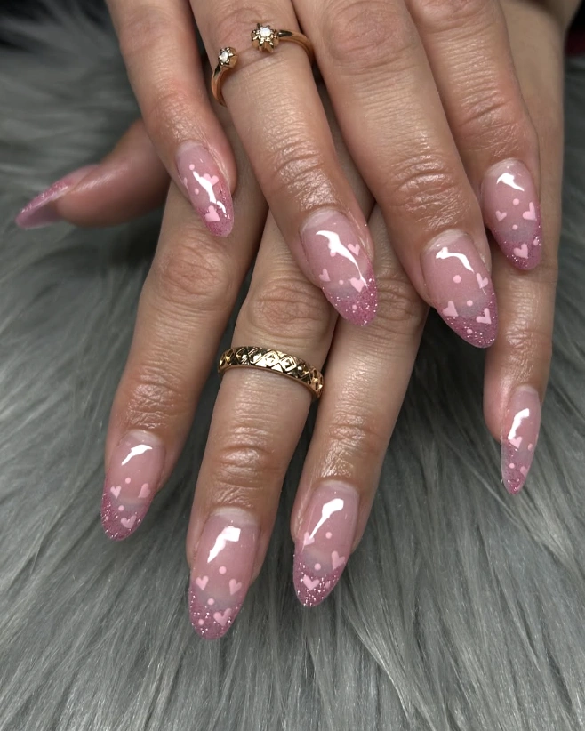 Sheer Almond Nails with Pink Hearts and Glitter Tips