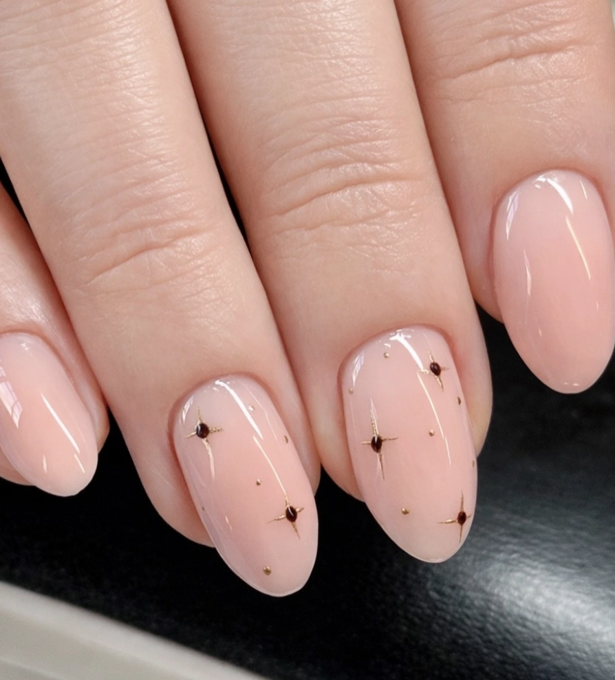 Sheer Blush Oval Nails with Delicate Star Details