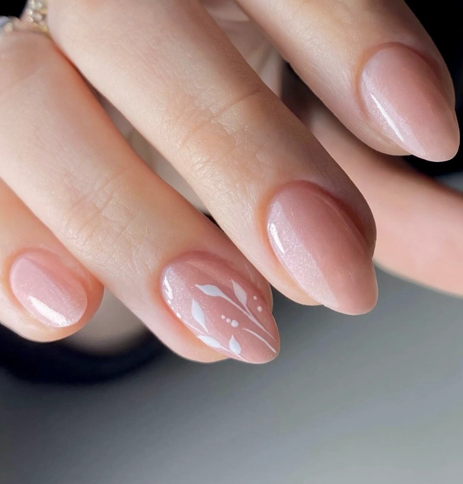 Sheer Nude Almond Nails with White Floral Accent