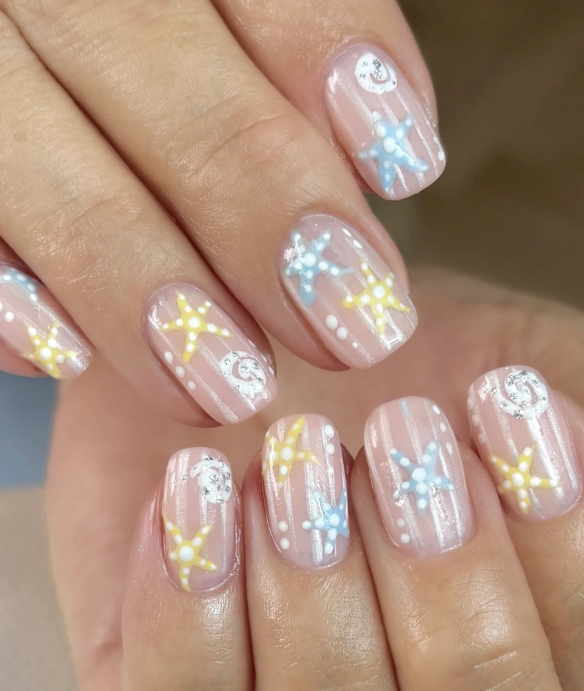 Sheer Pink Nails with Starfish and Seashell Accents