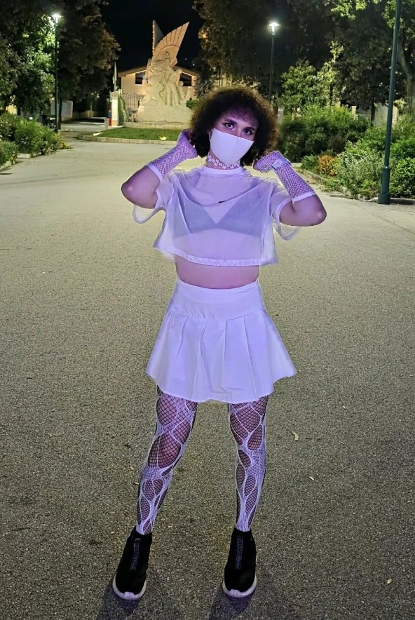 Sheer White Crop Top + White Tennis Skirt + Patterned Tights + Black Sneakers