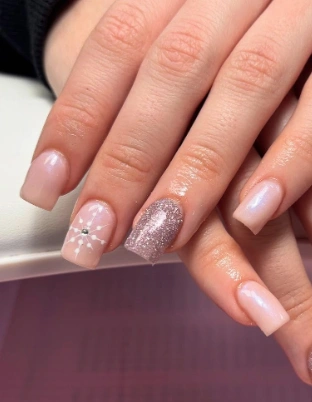 Shimmering Nude Square Nails with Snowflake Accent
