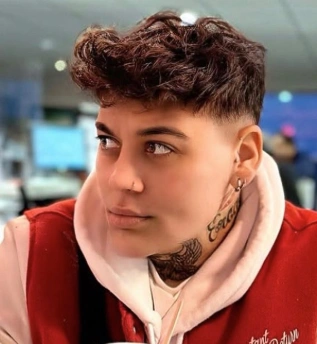Short Curly Tomboy Hair with Defined Texture and Clean Fade