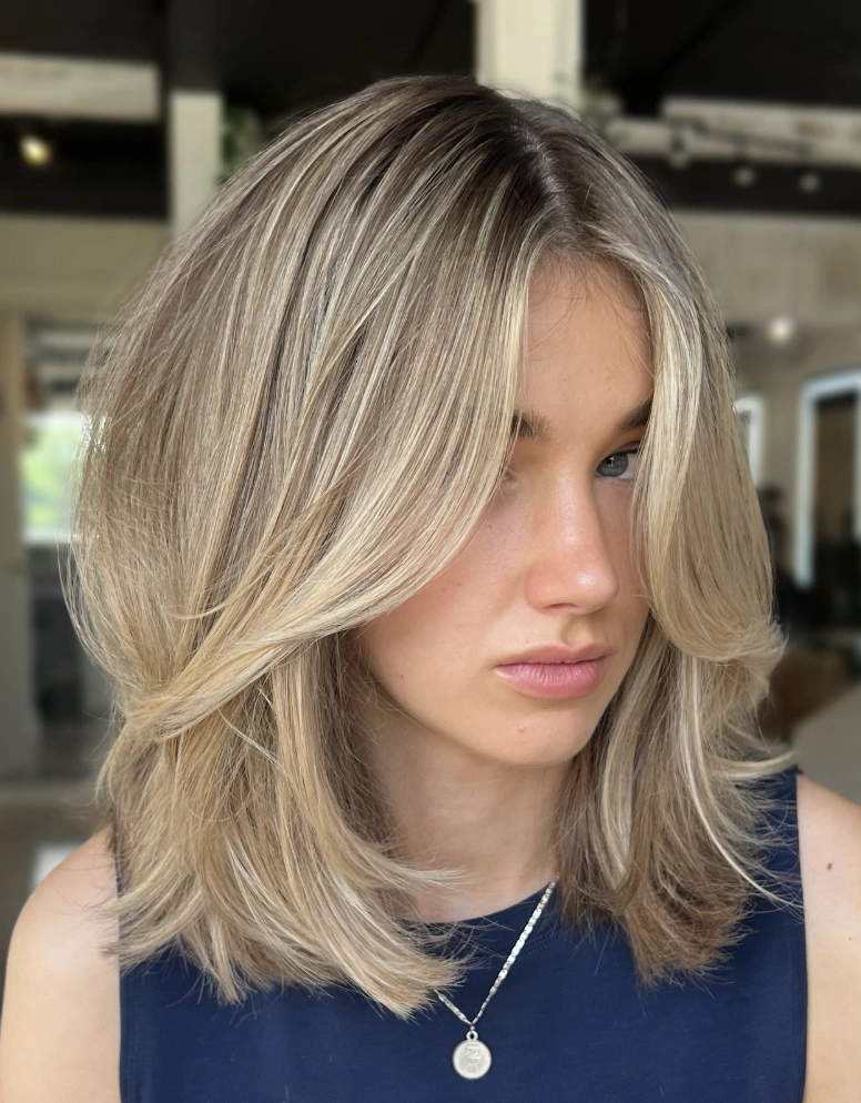 Shoulder-Length Blonde Layers with Face-Framing Pieces