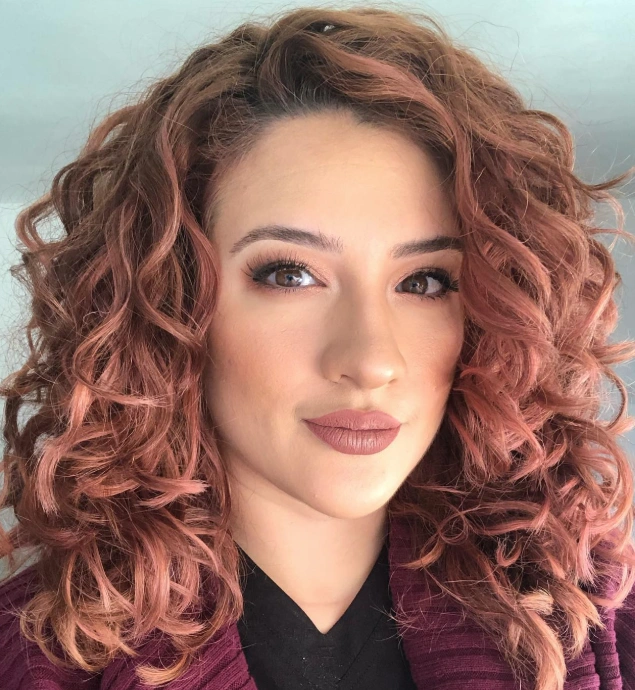 Shoulder-Length Curly Hairstyle with Rose Brown Hair Tones