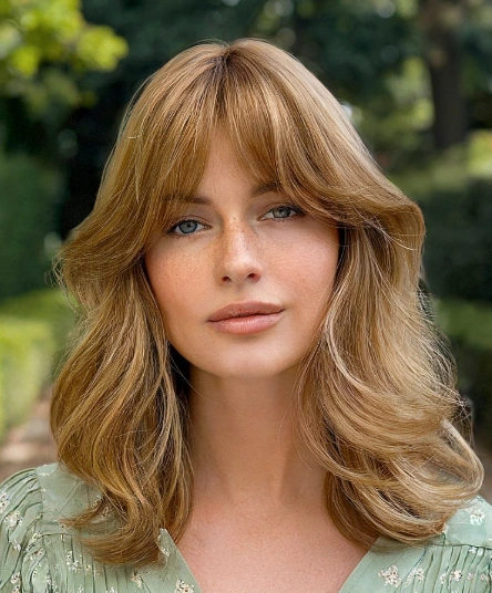 Shoulder-Length Old Money Curly Hair with Soft Bangs and Natural Waves