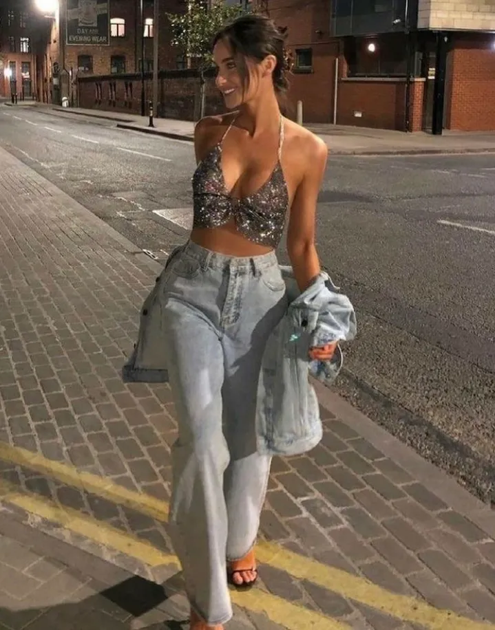 Silver Sequin Halter Crop Top + Light Wash High-Waisted Straight-Leg Jeans + Light Wash Denim Jacket + Black Strappy Sandals