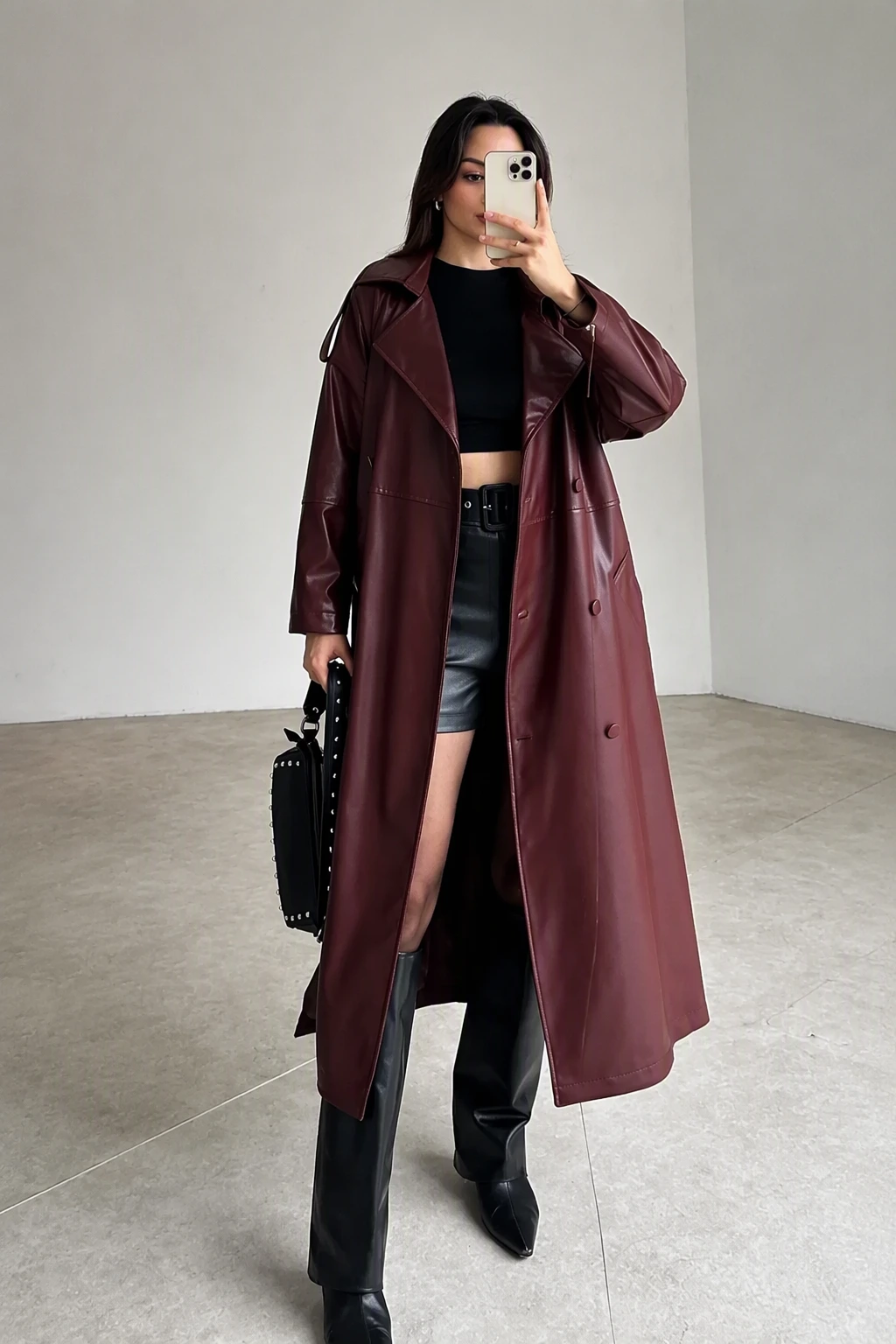 Sleek and Modern: Burgundy Leather Coat + Black Ensemble