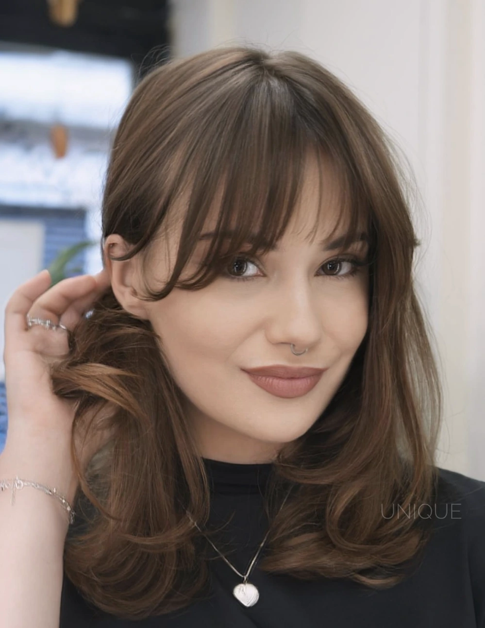 Soft Layers with Curtain Bangs and Rounded Ends