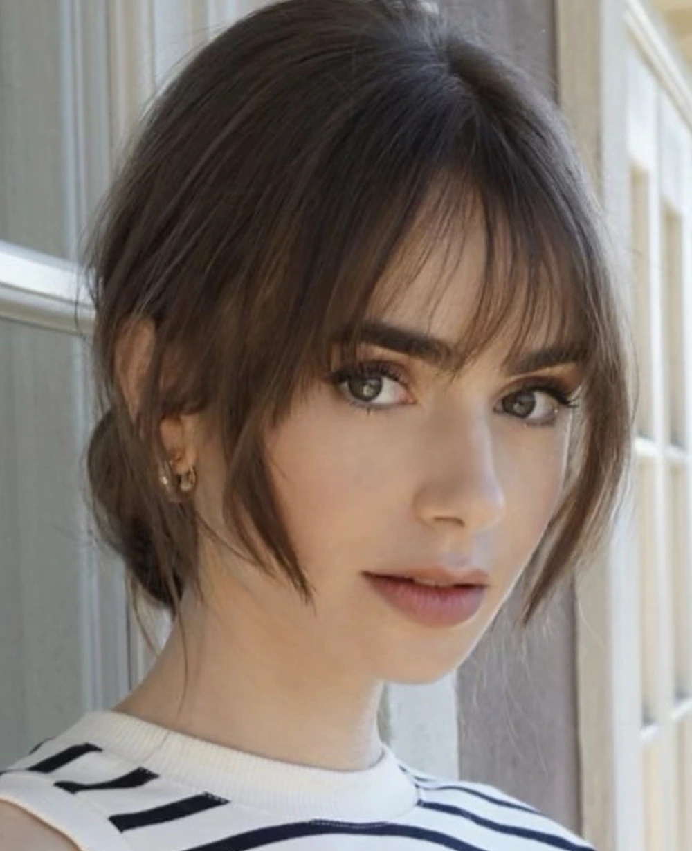Soft Low Bun with Wispy Bangs for Medium-Length Layers