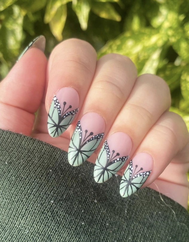 Soft Pink Almond Nails with Mint Butterfly Accents