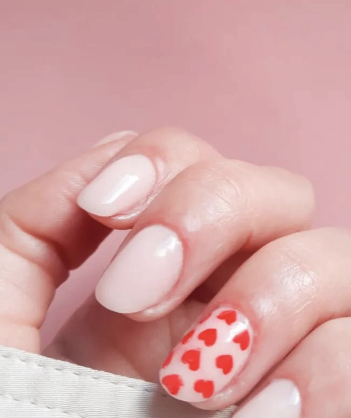 Soft Pink Almond Nails with Red Heart Accent Nail