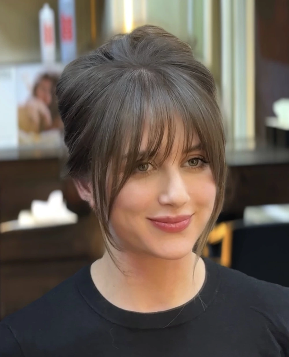 Soft Twist Updo with Curtain Bangs and Loose Face-Framing Layers