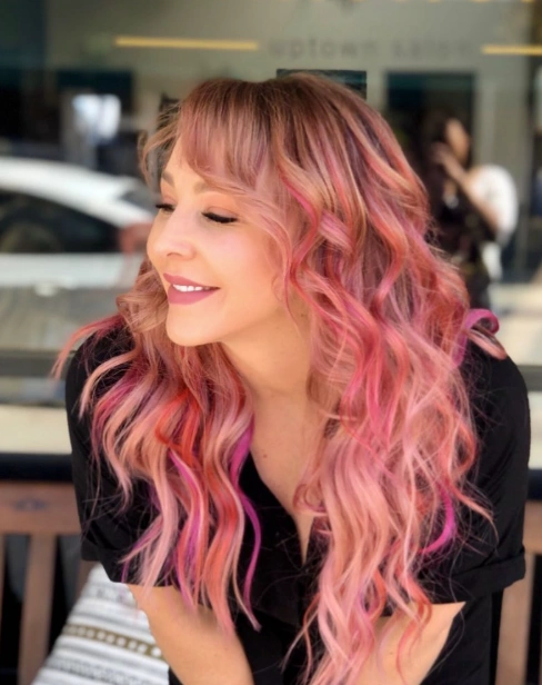 Soft Waves with Pink Blonde Hair and Textured Bangs