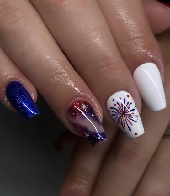 Sparkling Blue Coffin Nails with Firework Designs and Bold Accents