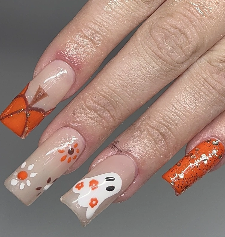 Spooky Ghost and Pumpkin-Inspired Coffin Nails with Glitter Accents