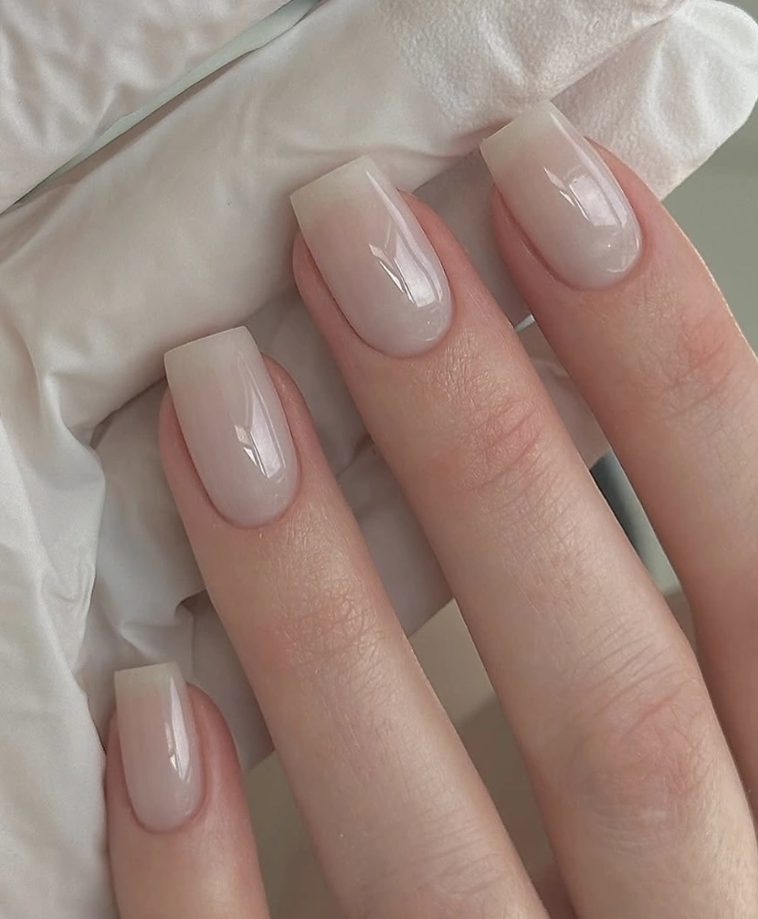 Square Milky French Nails with a High-Gloss Finish and Subtle Ombre Effect