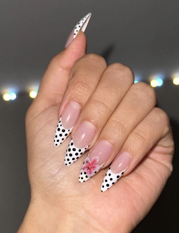Stiletto French Manicure with Black Polka Dots and Floral Accent