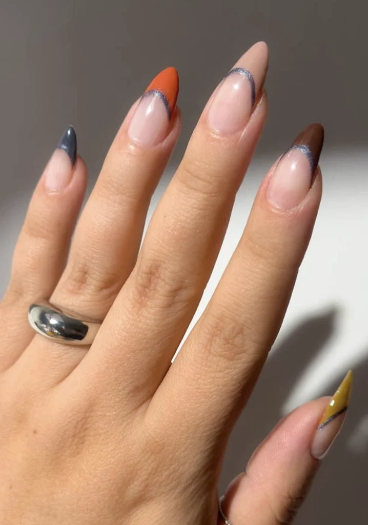 Stiletto Nails in Autumn Hues with Glittery Tips and a Matte Finish