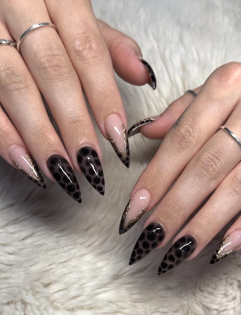 Stiletto Nails with Black Leopard Print and Gold Accents