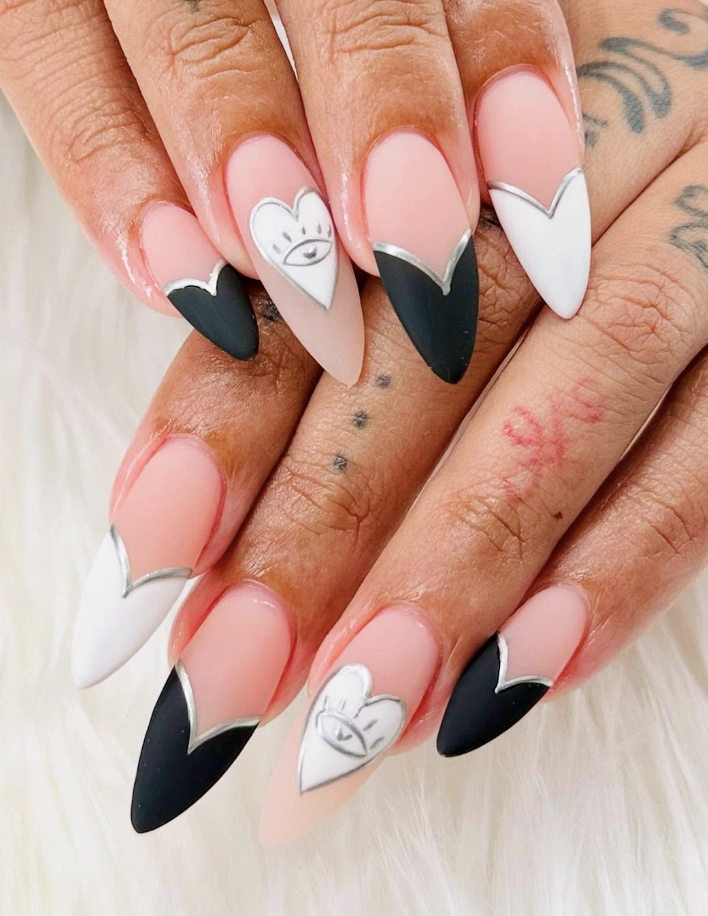 Stiletto Nails with Black, White French Tips, and Heart Decals