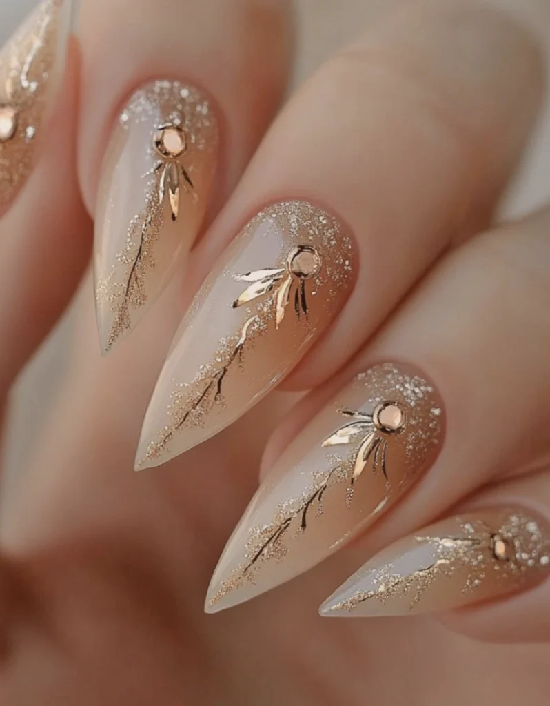 Stiletto Nude Ombre Nails with Golden Floral Appliqués