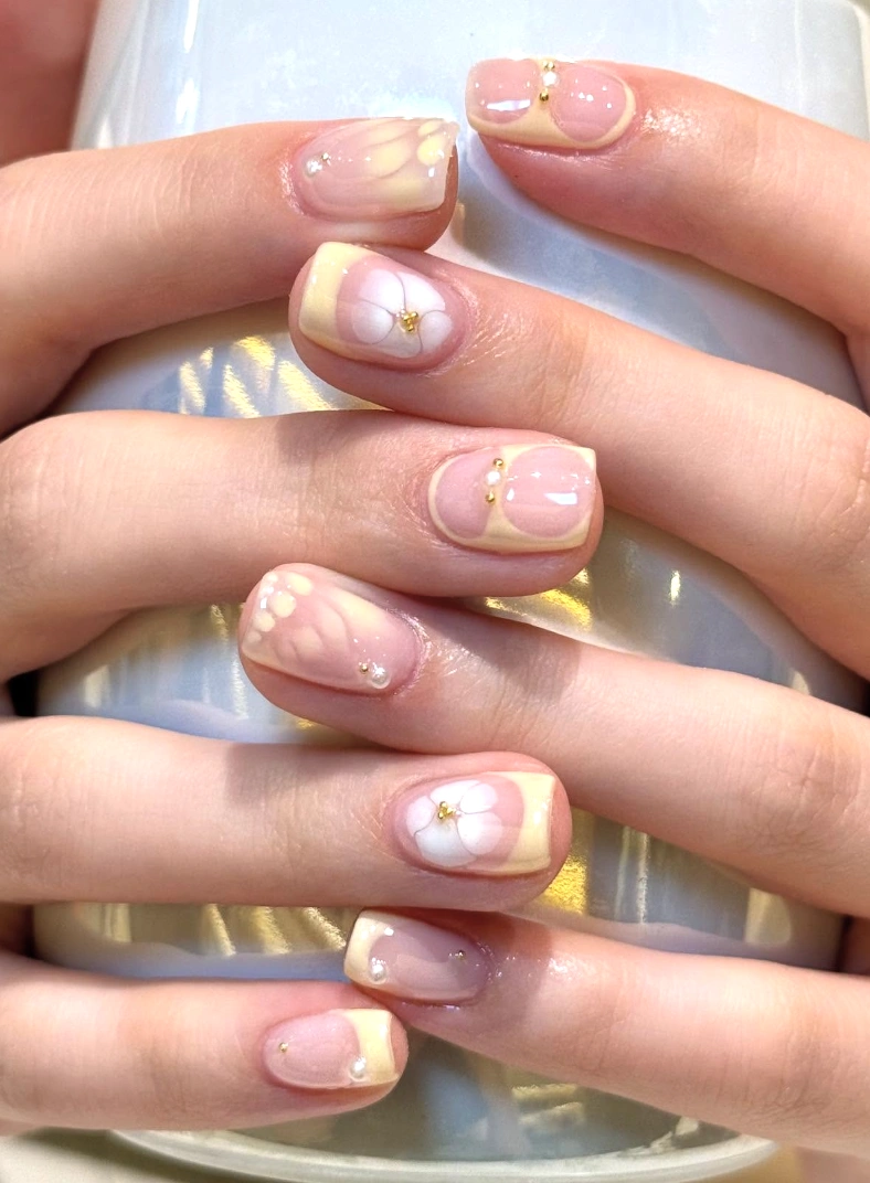 Subtle Florals: Pale Yellow Tips with White Blossom Accents
