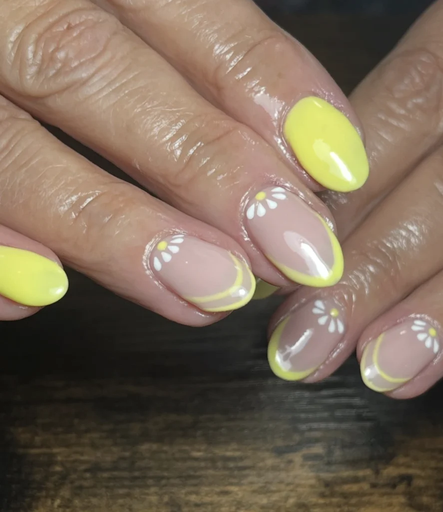 Sunny Yellow Almond Nails with Daisy Accents