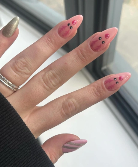 Translucent Pink Almond Nails with Quirky Face Detail