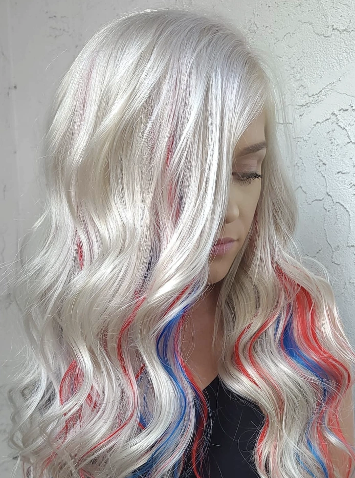 Vibrant Long Hair with Beachy Waves and Patriotic Red, White, and Blue Highlights