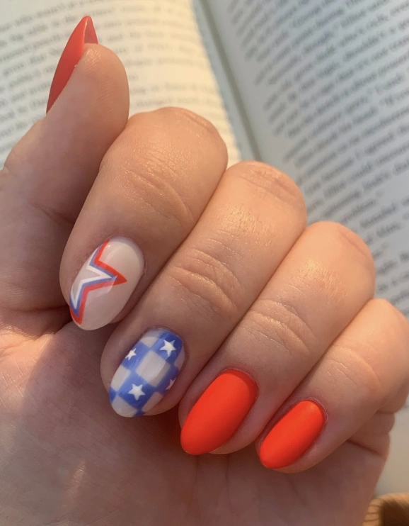 Vibrant Red Almond Nails with Patriotic Star Accents and Checkerboard Design