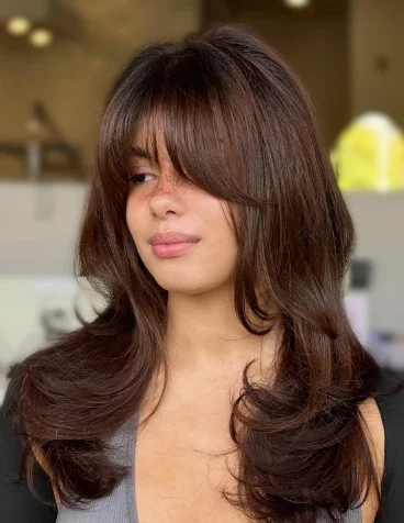 Voluminous Layered Hair with Curtain Bangs