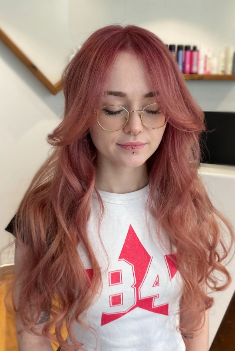 Wavy Long Hair with Face-Framing Layers and Rose Gold Tint