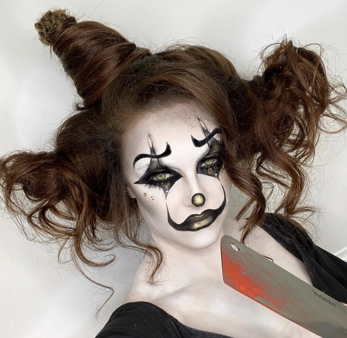 Whimsical Clown-Inspired High Bun with Loose Curls