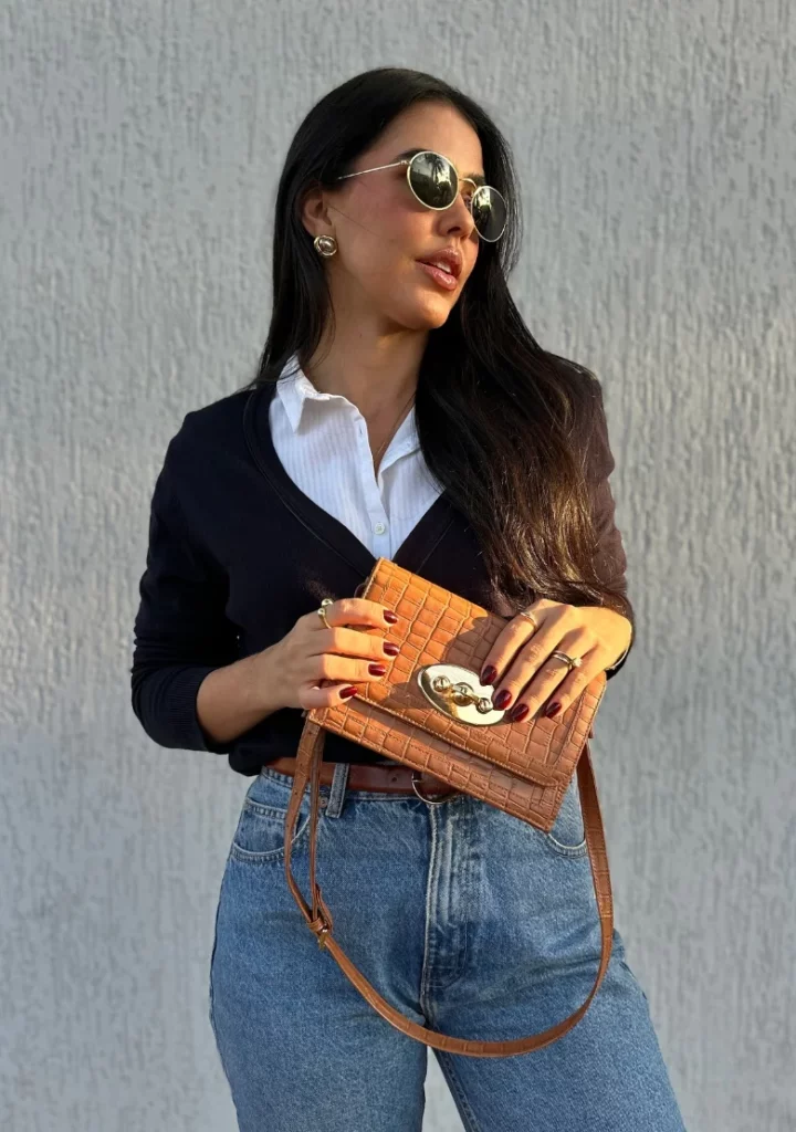White Button-Up Shirt + Navy Cardigan + High-Waisted Blue Jeans + Brown Leather Belt