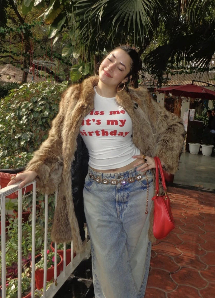White Graphic T-Shirt + Light Blue Wide-Leg Jeans + Brown Faux Fur Coat