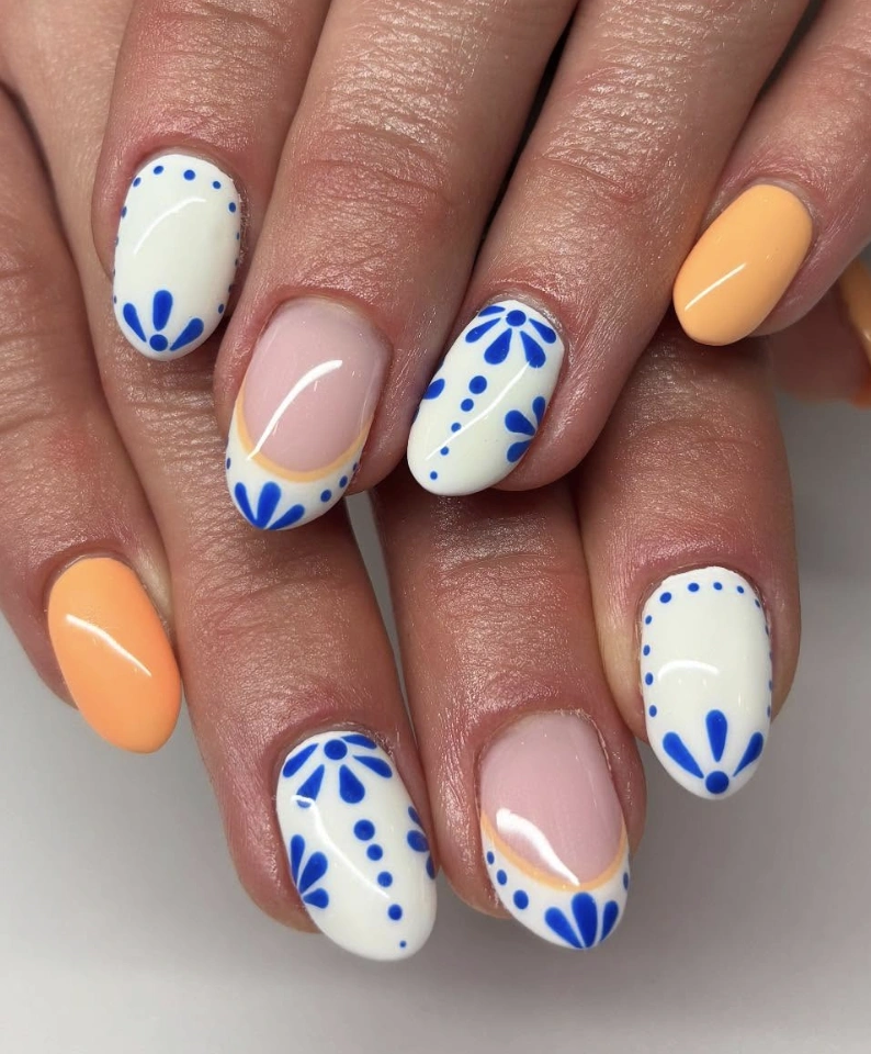 White Nails with Delft Blue Inspired Floral Design and Peach Accents
