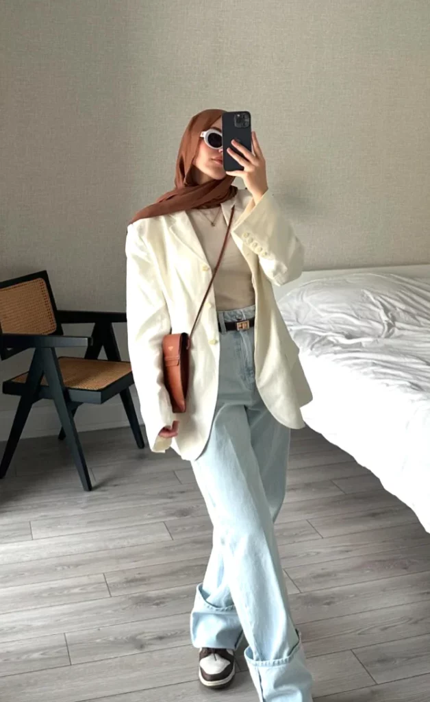 White Oversized Blazer + Cream Turtleneck Top + Light Wash Wide-Leg Jeans + Brown Belt + Brown Headscarf + Black White Sneakers