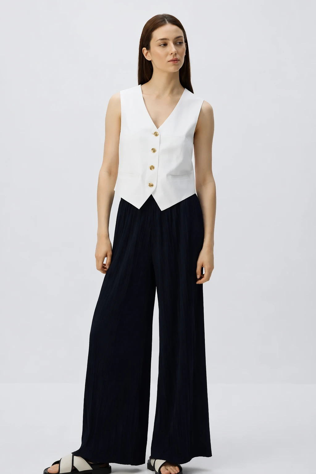 White Vest + Navy Pleated Trousers + Sandals